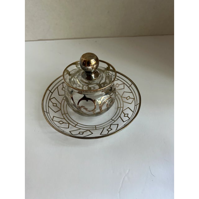 4 piece Art Deco condiments set of glass with sterling details. Includes creamer, sugar bowl and small jam or pot with lid...