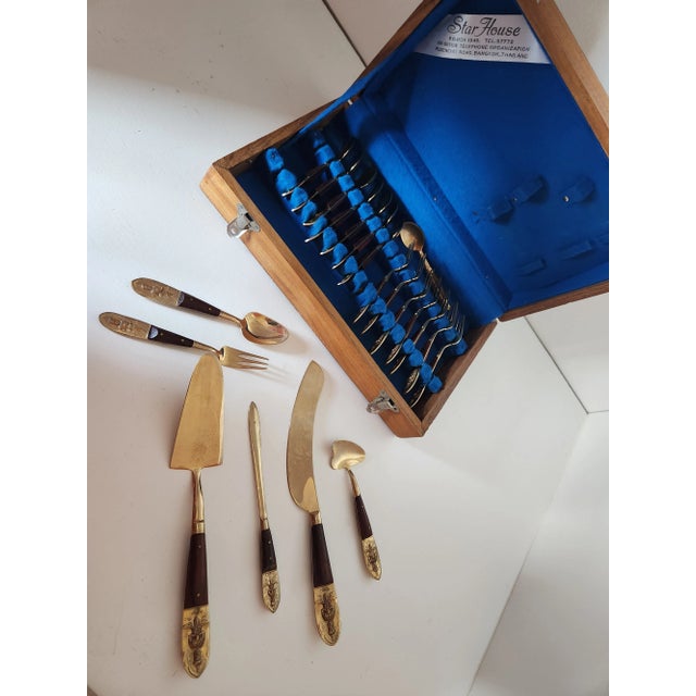 This 20 piece set made in Thailand is made of brass and wood. Set includes original felt lined wooden case, and notation...