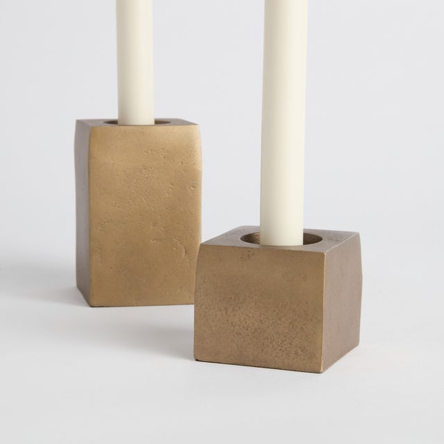 Solid rectangle forms in a cast aluminum, this set of 2 candleholders are made for the modern space. Finished in an...