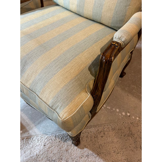 Delightfully tropical as Palm Beach does so well, this lovely pair of French style hand carved Fauteuil chairs with...