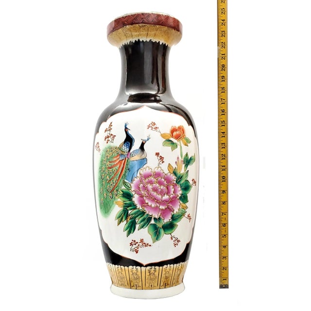Offering a LARGE vintage Chinese porcelain floor vase, circa Late 20th Century. The vase has a vignette of a pair of...