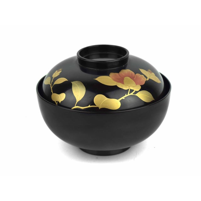 Exhibiting the refined elegance of mid-20th-century Japanese craftsmanship, this exquisite lidded rice bowl is a stunning...