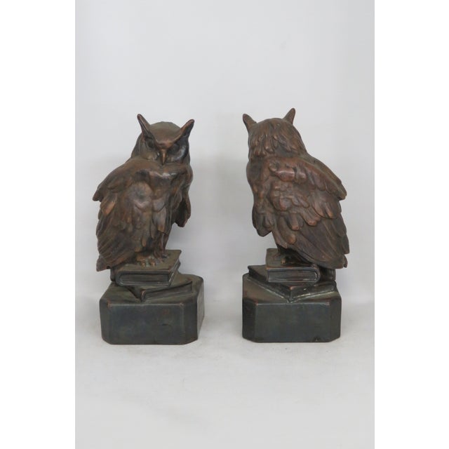 This lovely pair of bookends / sculpture is made of metal. This unique pair of bookends is a depiction of owls sitting on...