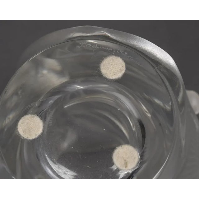 Translucent glass vase decorated with swifts in flight, arranged in an ascending spiral. The birds are depicted in high...