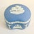 This is a pretty Wedgwood Blue Porcelain Trinket Box. The English Hollywood Regency style box features Greek Hellenic and...