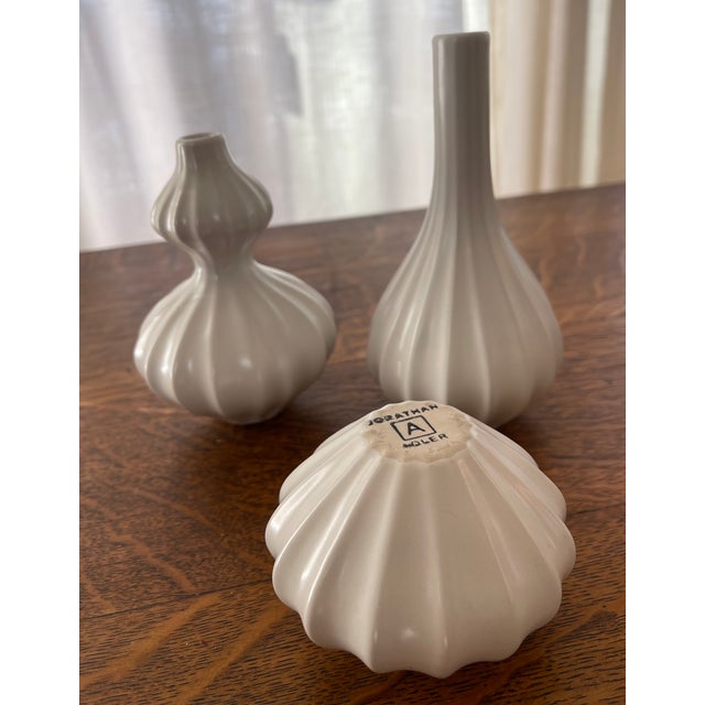 A trio of petite Jonathan Adler, ceramic vases.
