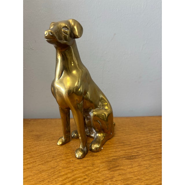 This charming vintage English brass dog may not be finely detailed, but it is all the lovelier for it. Clean in line and...