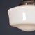 A mid 20th century english pendant light, made from white opaque glass with the original copper tops. A simple art deco...