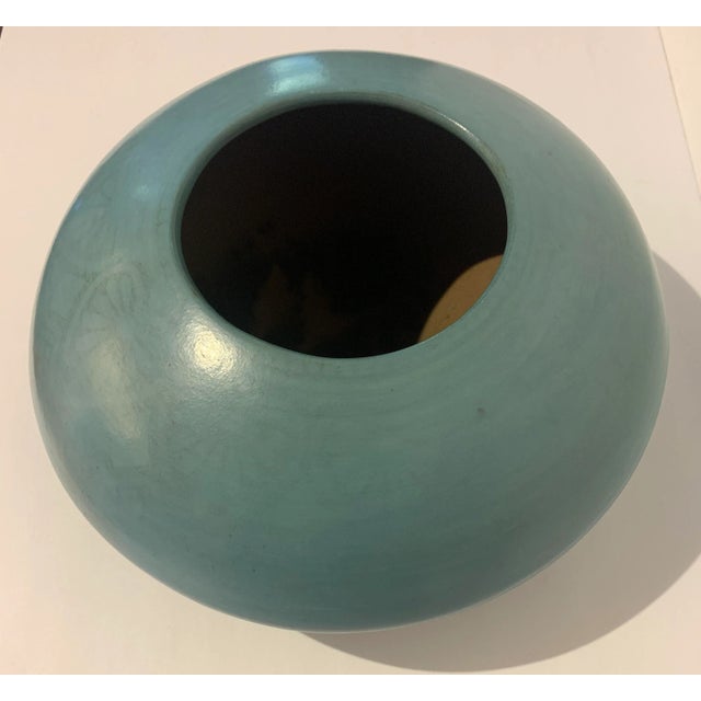 This vessel has been hand made and burnished by hand with a stone. Beautiful color with faint black decoration around the...