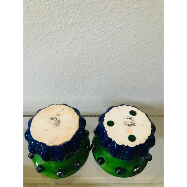 Transform your space with this pair of ceramic art deco-style cachepots, marrying the allure of vintage design with modern...