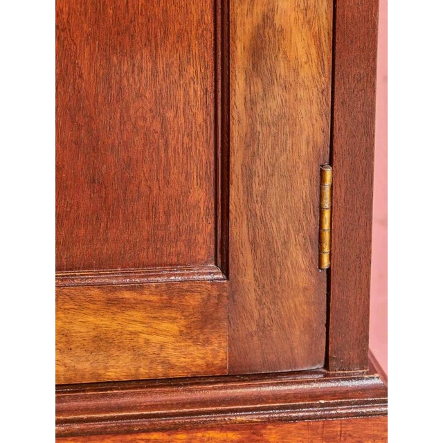 Antique Regency period bookcase. Bookcase with a glazed upper part with split glass in the doors and a lower part with...