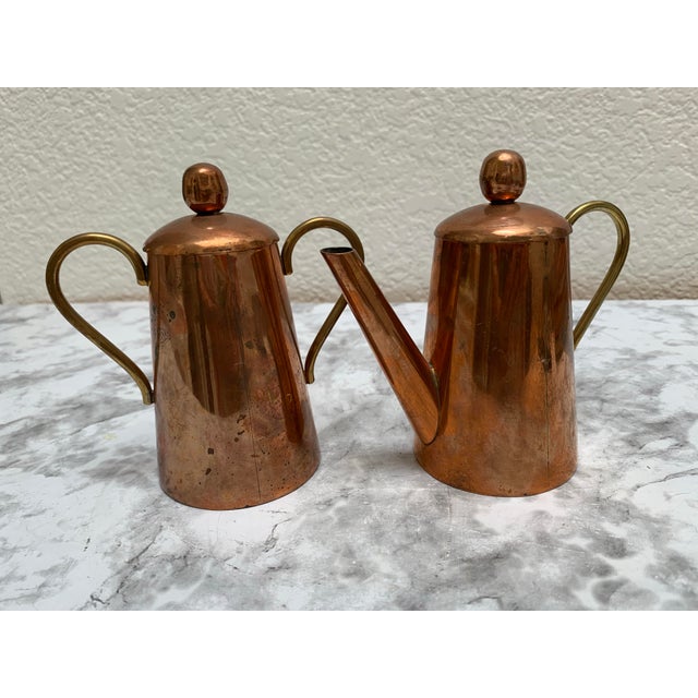 Rustic earthy copper cream and sugar vessels with brass handles and naturally aged patina. Hand crafted and unusual set...