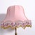 This pair of vintage table lamps features a brass base and pink lampshades decorated with beaded fringe. 1960s/1970s...
