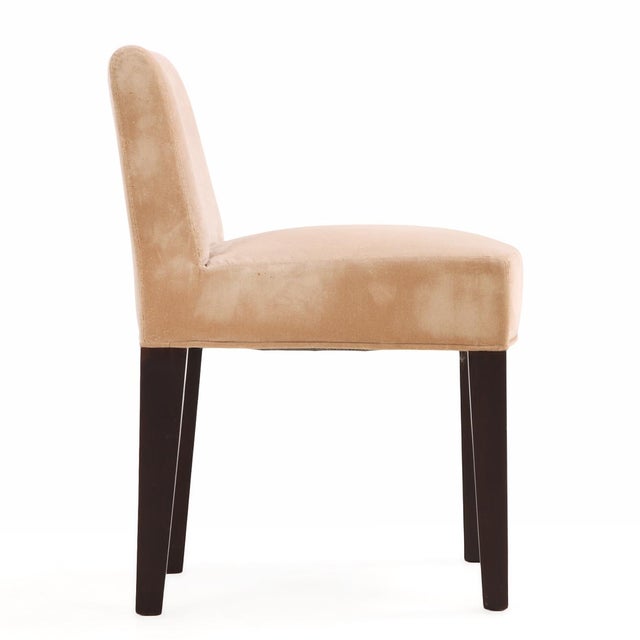 A set of six contemporary dining chairs designed by Romeo Sozzi for Promemoria, crafted in dark walnut and upholstered in...