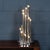 A striking and sculptural table lamp by reggiani, italy, dating to the 1970s. The design features an arrangement of...
