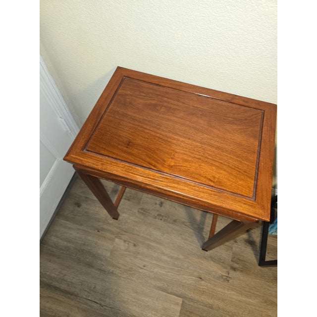 Lovely set of four Asian hardwood nesting tables. This well made, simple but elegant set is a great addition to your...
