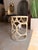 Elevate your space with this Mr. Brown Wolfgang End Table, a striking blend of contemporary and transitional design....