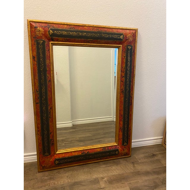 Intricately designed leather wrapped mirror. Color is red, black and gold. A few small imperfections ( see pictures)...