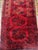This beautiful hand-knotted rug is a classic Bokhara piece, recognizable by its signature "gul" motifs arranged in neat...