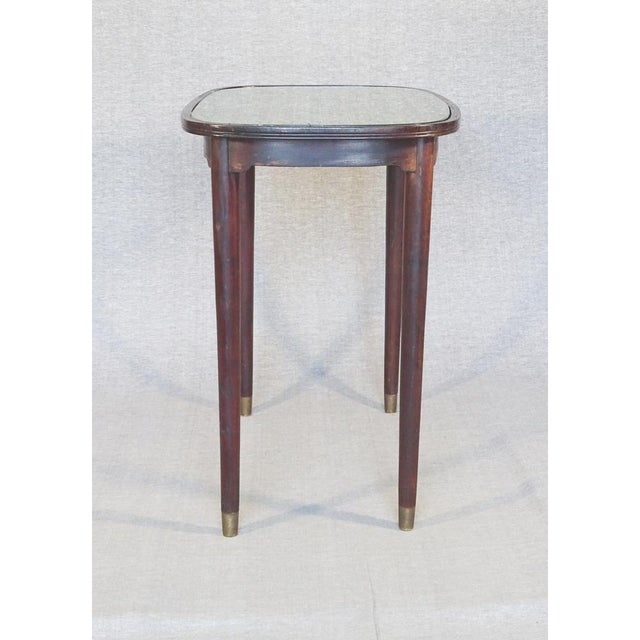 It is in perfect condition, its glass is original. We chose to put a Backhausen fabric against it (No. MD586A06...