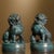 This is a striking pair of vintage bronze guardian lions, also known as Foo Dogs or "Oriental Awakening Lions." Each lion...