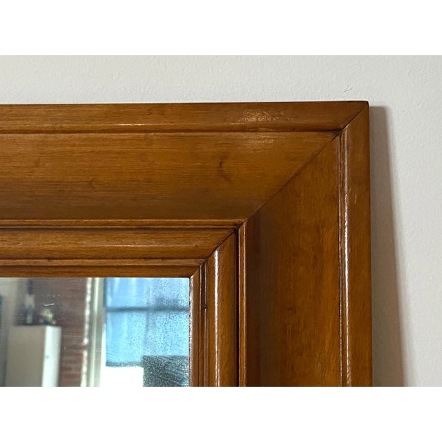 This Mid-Century Maple Willett Wall Mirror, circa 1952, Lancaster County is in superb condition and a beautiful accent to...