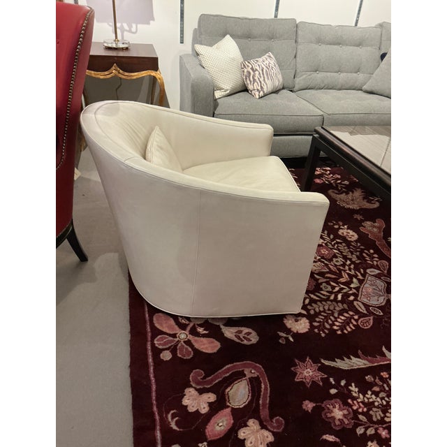 Classic tub chair by Baker Furniture in cream pearl leather. This chair is new out of the Baker showroom.