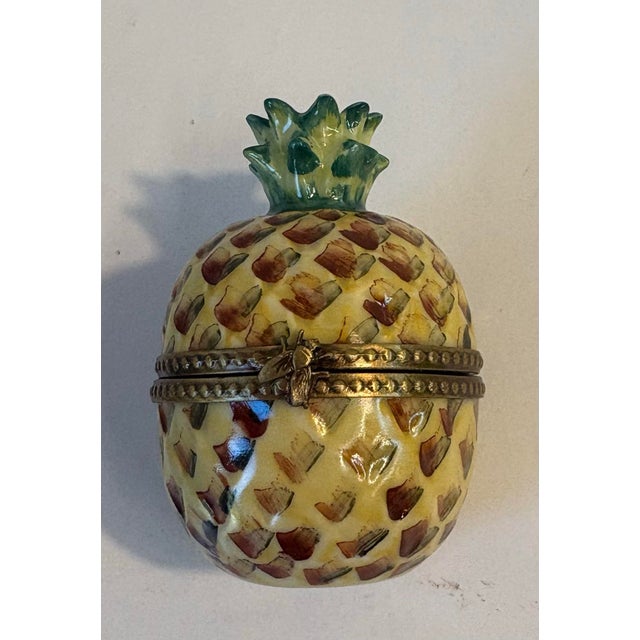 Lovely Limoges Trinket Box, hand made and hand painted in France. It has brass fittings and a decorative fly fastener....