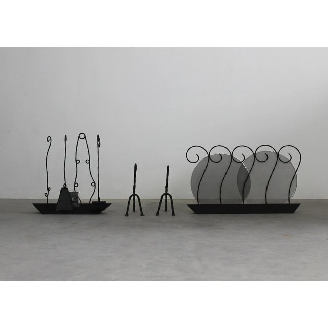 Unique fireplace accessories set composed of a couple of andirons, four different tools ( tongs, poker, shovel, brush)...