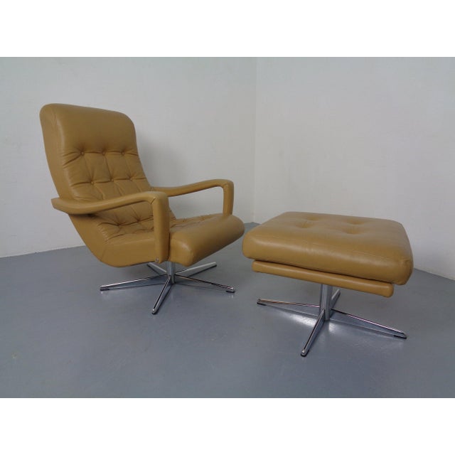 Mustard-colored, swivel leather armchair with ottoman from the 1960s. According to the previous owner, it was made in...