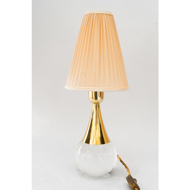 Glass/brass table lamp with fabric shade vienna around 1950s Brass polished and stove enameled The fabric shade is...