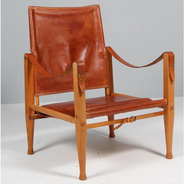 Kaare Klint for Rud Rasmussen. Safari chair original patinated aniline leather. Straps maintained in the original...