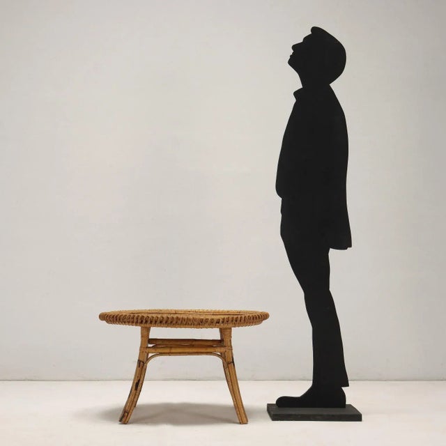 Vintage Italian-made coffee table with bamboo structure and woven rope top. This piece is attributed to the mentioned...