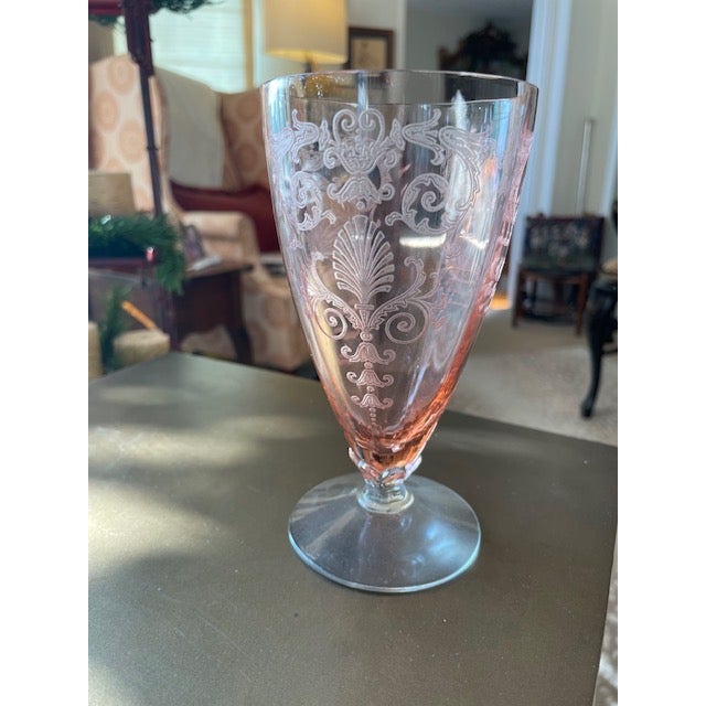 Set of 12 pale pink footed tumblers in Fostoria Versailles pattern. Glasses are 5 7/8" tall and 3" wide at the rim of the...