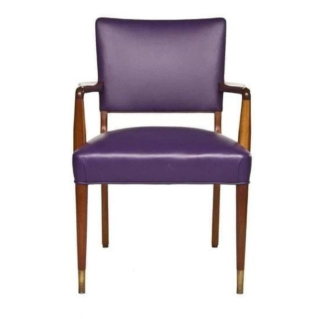 A sophisticated Danish Mid-Century Modern armchair dating to circa 1960, combining beautifully sculpted exposed wood with...