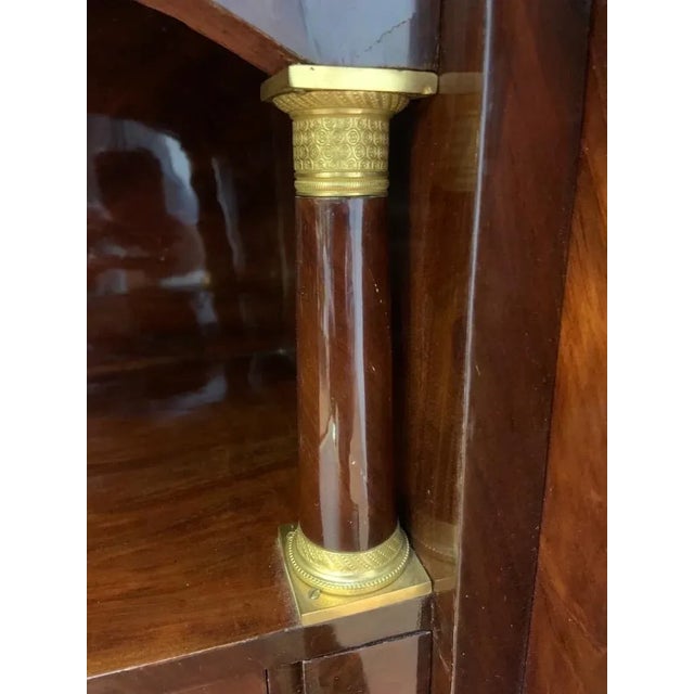 Antique Imported French Empire Flame Mahogany Gilt-Bronze Mounted Marble-Top Abattant Secretary Desk This 19th-century...