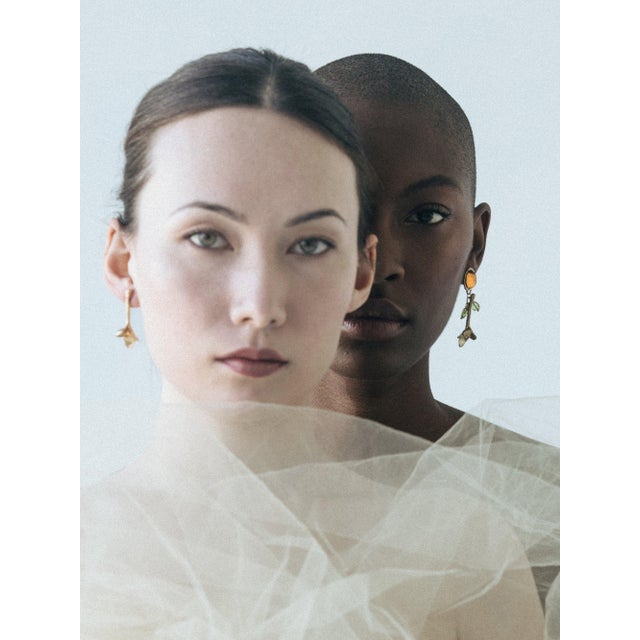 The Tulip flowers are hand-carved from wax and hang easily on ears with almost no weight. A pop of topaz color gives them...