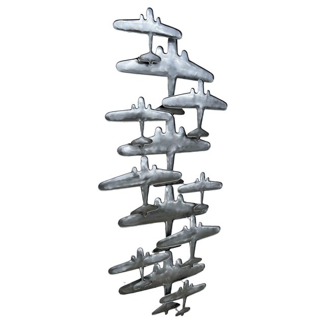 This striking wall sculpture by Artisan House features a dynamic squadron of mid-century inspired aircraft captured in...