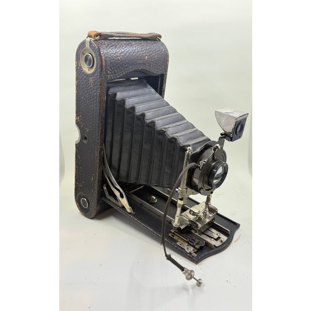 Overview: A striking piece of early 20th century photographic history, this Eastman Kodak NO. Three a folding pocket...
