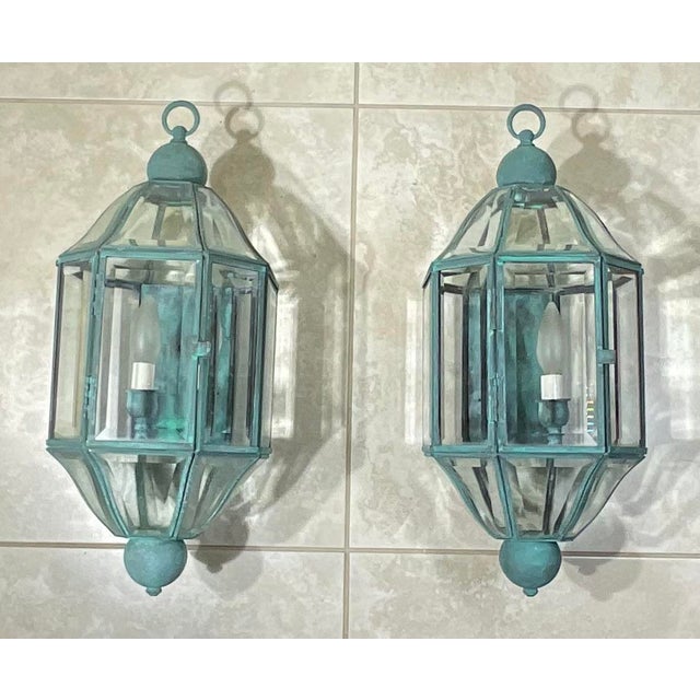 rare pair of vintage solid brass and beveled glass wall lanterns (sconces), featuring a classic hexagonal carriage or...