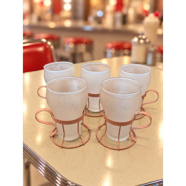 Step back into the golden age of American soda fountains with this charming set of five vintage frosted drinking glasses,...