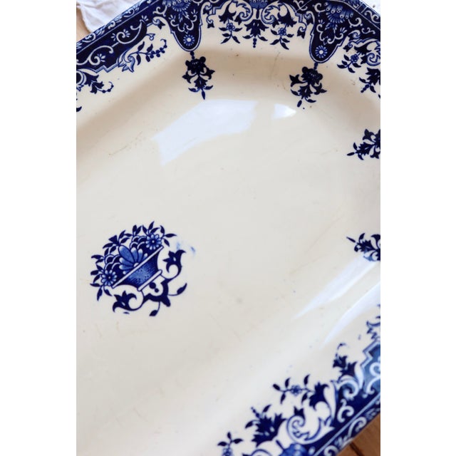 A very beautiful and large oval Longchamp ironstone platter, Rouen pattern, late 19th century. Its iconic blue decoration...