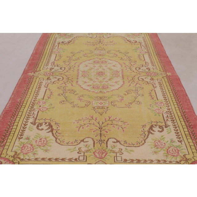 Hand-knotted in wool and originating circa 1950-1960, this 6x11 vintage rug is a vibrant and exciting addition to Rug &...
