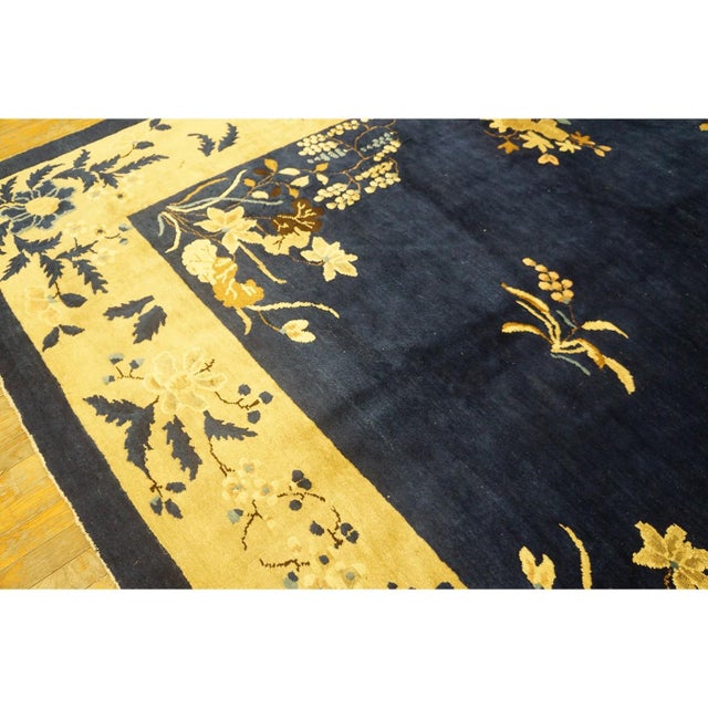 Antique Peking Room Size Wool Blue Rug, Circa Date: 1920s. This magnificent example of early 20th-century Chinese weaving...