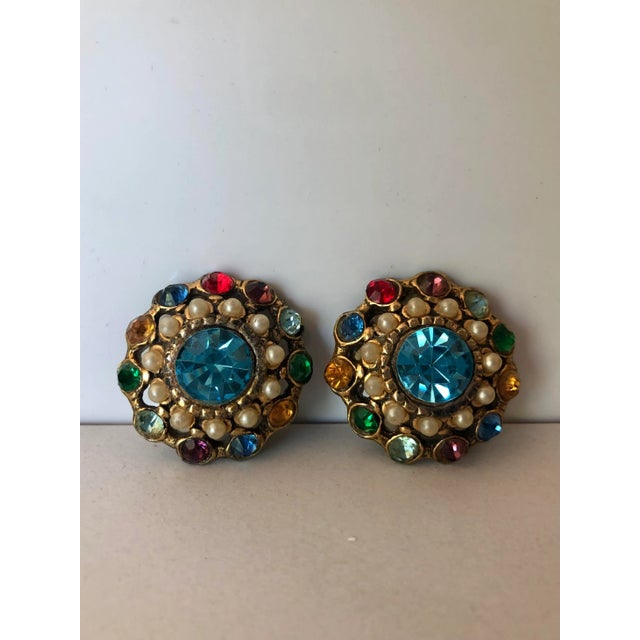 This beautiful and vibrant pair of Vintage Mexican Colored Crystal and Petit Point Pearl Cluster Earrings are sure to...