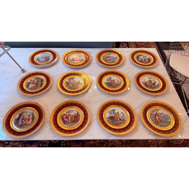 Design Plus Gallery presents a Set of Twelve Rouge with Gold Etched Border Plates in the Style of Royal Vienna. The plates...