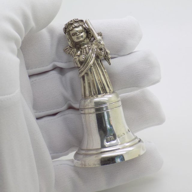 A beautiful vintage object in the form of a bell with an angel figure, crafted in Florence, Italy between the 1980s and...