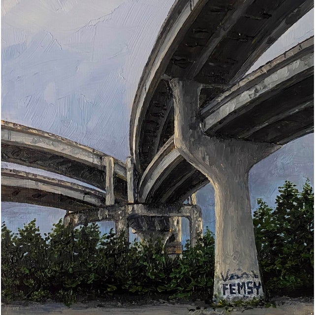 Raleigh Street captures a dynamic urban landscape, showcasing the intricate interplay of concrete overpasses against a...