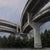 Raleigh Street captures a dynamic urban landscape, showcasing the intricate interplay of concrete overpasses against a...