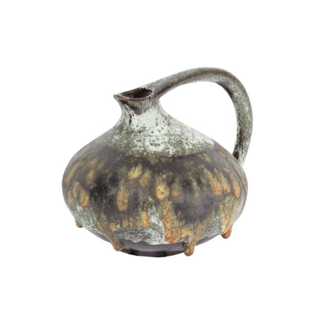 A West German ceramic pitcher designed by the German ceramicist Kurt Tschorner for Ruscha Keramik. This pitcher has a...
